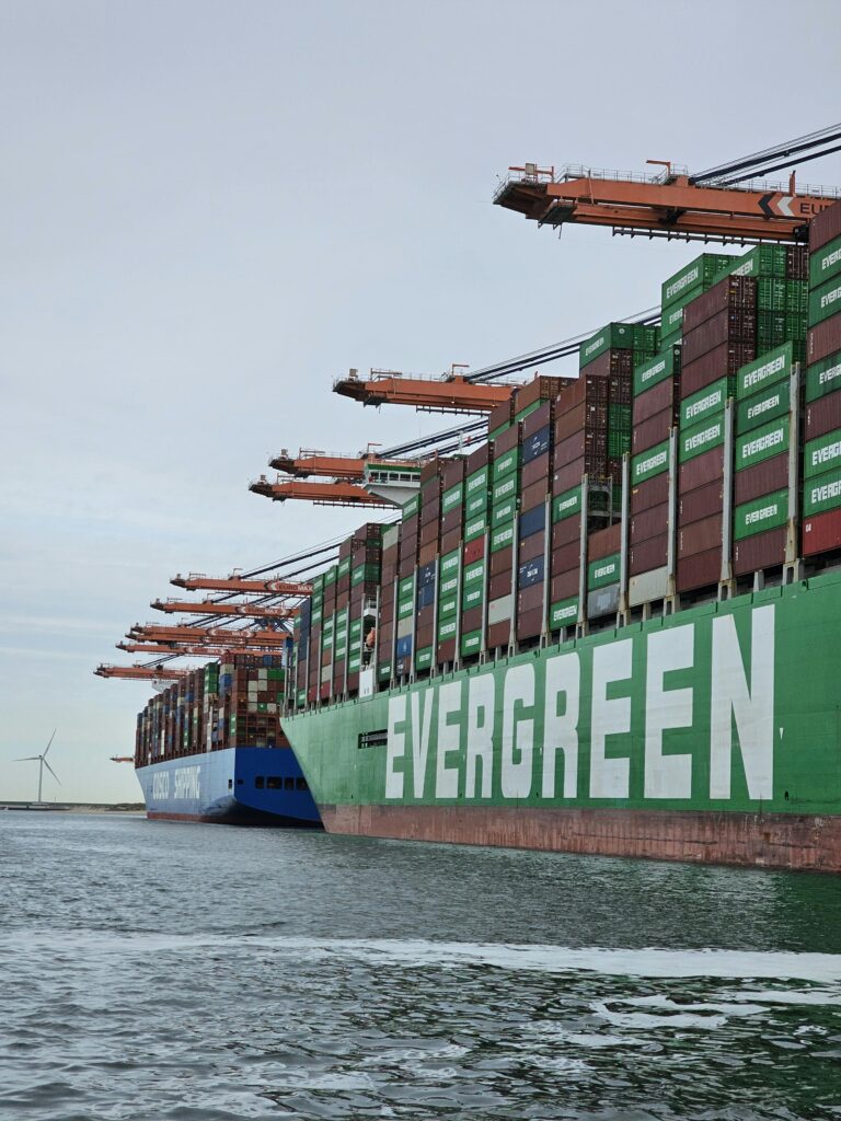 Large container ships docked at Maasvlakte, Rotterdam, showcasing global trade in action.